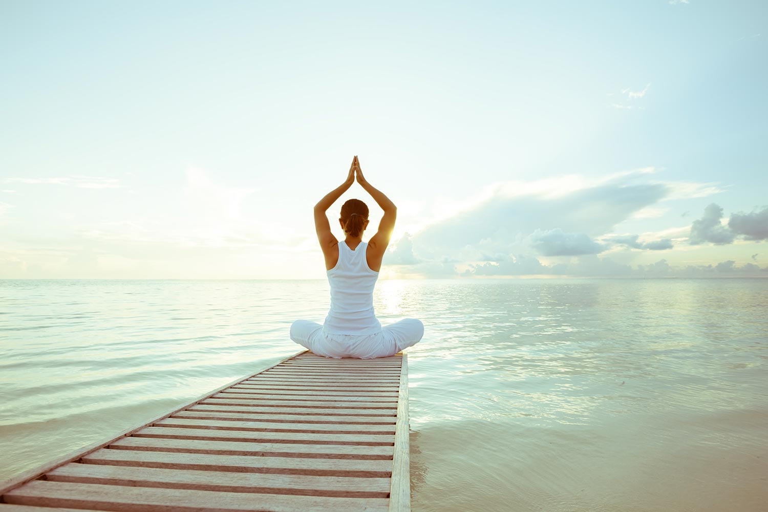 Woman Doing Yoga on a Dock